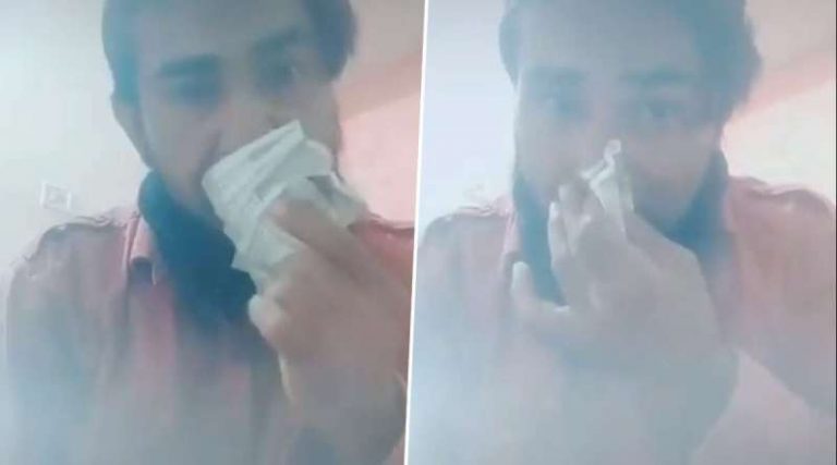 A Man wiping his dripping nose and mouth with currency notes