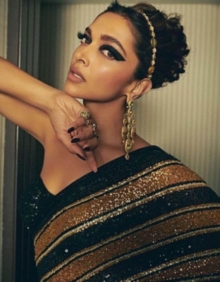 Deepika walks Cannes red carpet in a Sabyasachi sari inspired by the Royal Bengal tiger