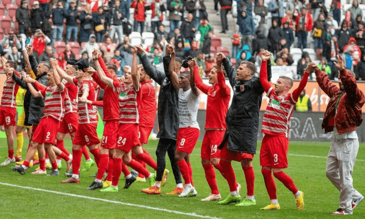 Augsburg upset Bayern, Dortmund go top with win over rivals Schalke in Bundesliga