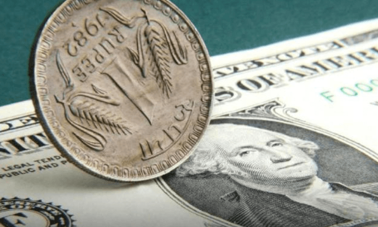 Rupee touches 82.72 against dollar before closing at 82.63
