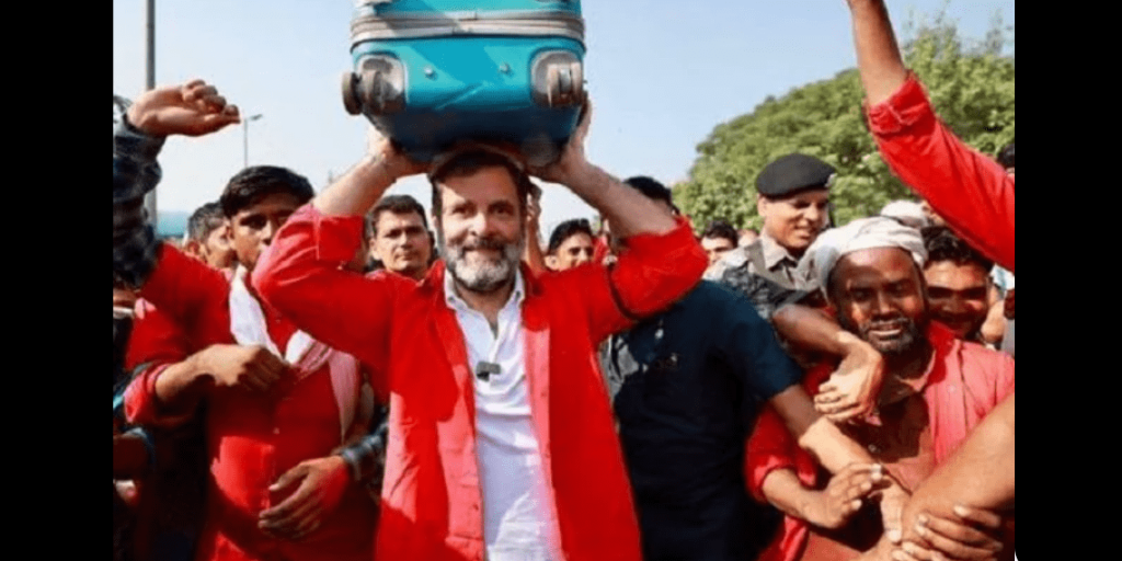 rahul, wearing a red shirt, attempts to address coolies' complaints