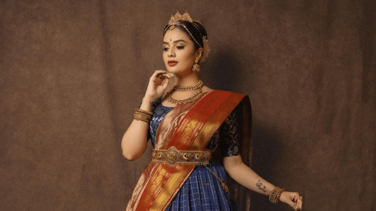 Sreemukhi dazzles in a stunning vintage-inspired blue and red ensemble.