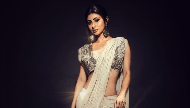 Mouni Roy stuns in a dazzling saree, showcasing her timeless beauty.