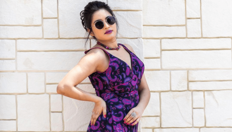 Rathika Rose shines in a radiant violet slim outfit