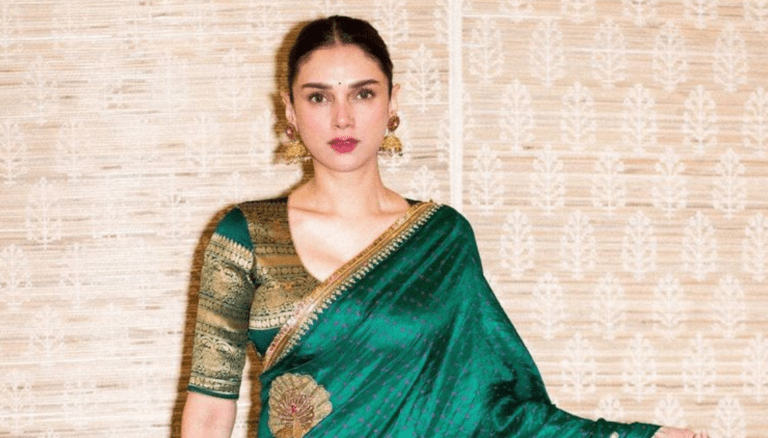 Aditi Rao Hydari appears glamorous and gorgeous in a green saree.