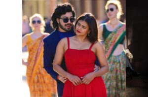 a man and woman in a red dress